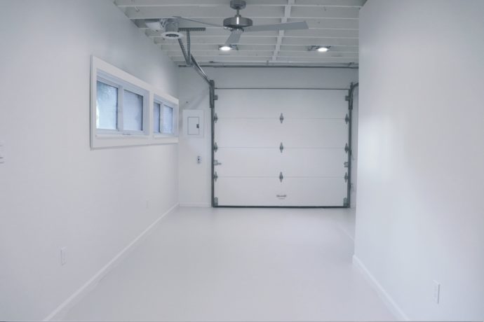 newly painted interior of a garage during a garage conversion project