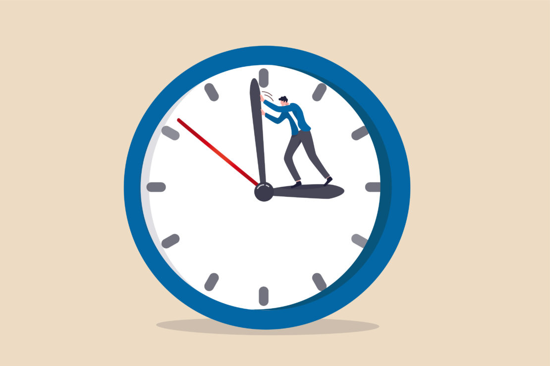 cartoon image of a blue clock against a tan background. A tiny man is in the center of the clock, pushing back the minute hand. 